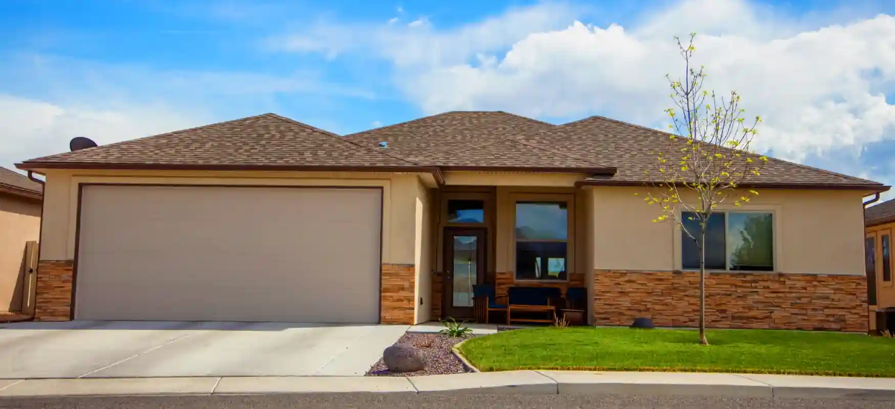 House With Stacked Stone And Tan Stucco Photo Compressed